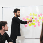 Young male manager running a meeting