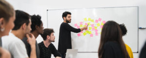 Young male manager running a meeting