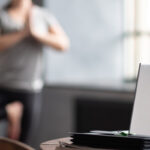 Doing yoga in front a laptop