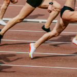 Group of athletes running on a track