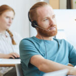 Customer service man on a headset talking to a customer