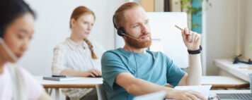 Customer service man on a headset talking to a customer