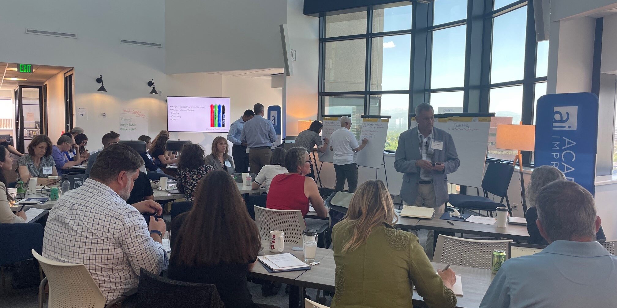 Group of attendees doing an activity at an Academic Impressions conference